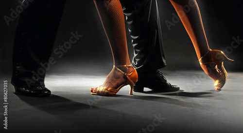 Feet partners on black background