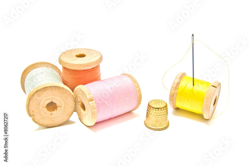 spools of thread with thimble