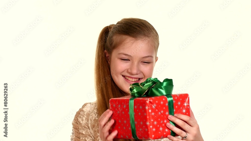 Girl stands with her eyes closed, opening them she sees box gift Girl stands with her eyes closed, opening them she sees box gift