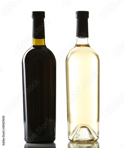Red and white wine bottles isolated on white