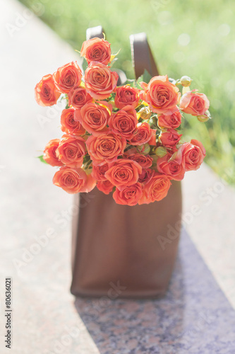 Fototapeta Naklejka Na Ścianę i Meble -  Red roses in a bag
