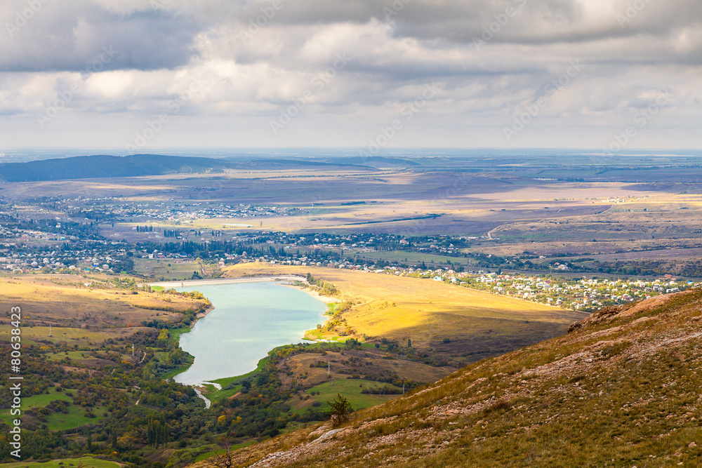 Sun valley and lake in the Crimean mountains