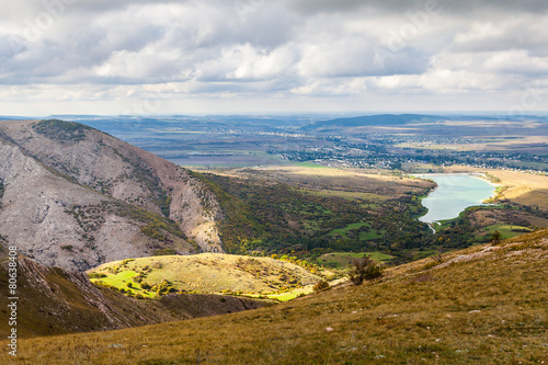 Sun valley and lake in the Crimean mountains