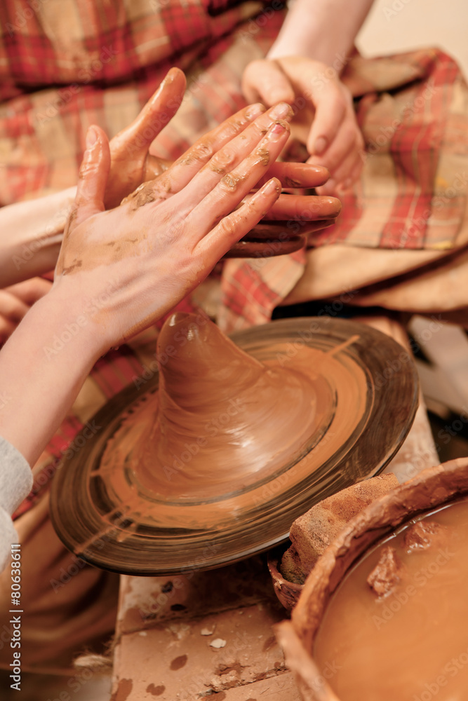 Fototapeta premium Shaping cay on pottery wheel