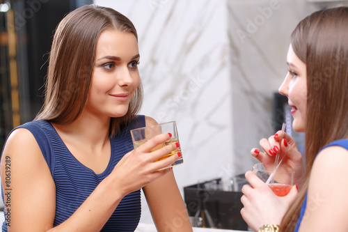 Women gossip in the bar