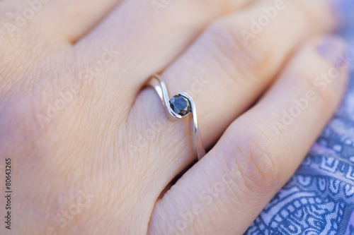 Woman's hand wearing a diamond ring