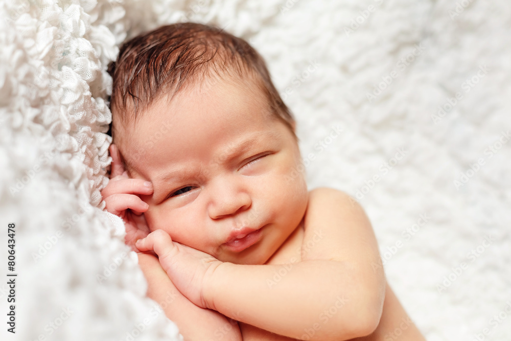 newborn baby sleeping in a baby cot newborn baby sleeping in a baby cot