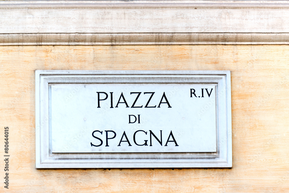 Piazza di Spagna sign on historic italian building in Rome Piazza di Spagna sign on historic italian building in Rome