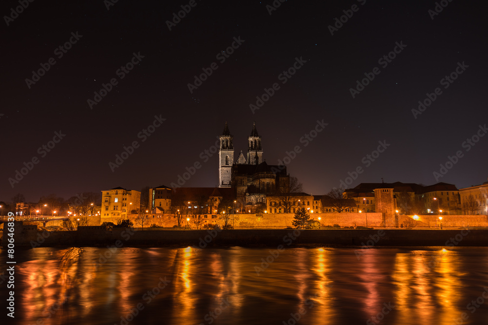 View of Cathedral of Magdeburg and the river Elbe at night with