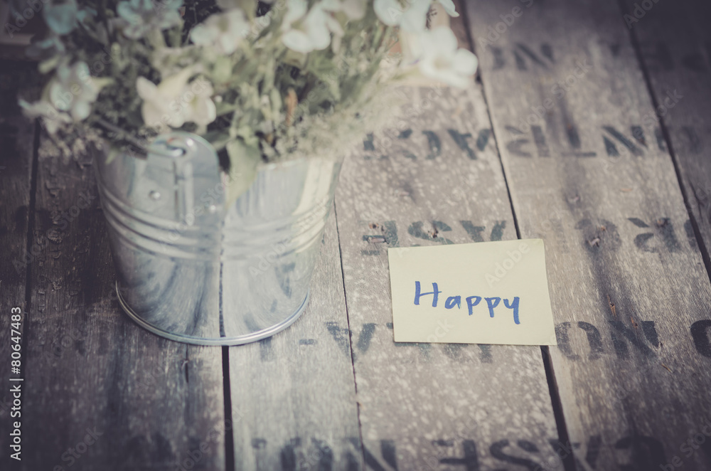 vintage style effect Happy message on  wooden background