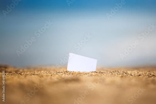 Visiting card on a beach