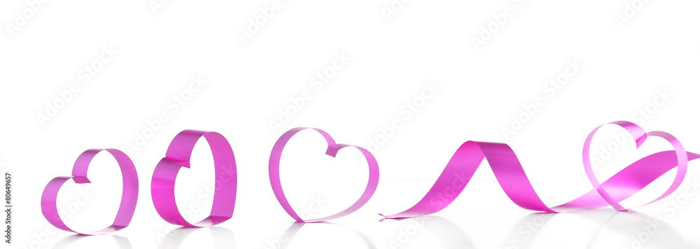 Purple hearts from ribbon isolated on white