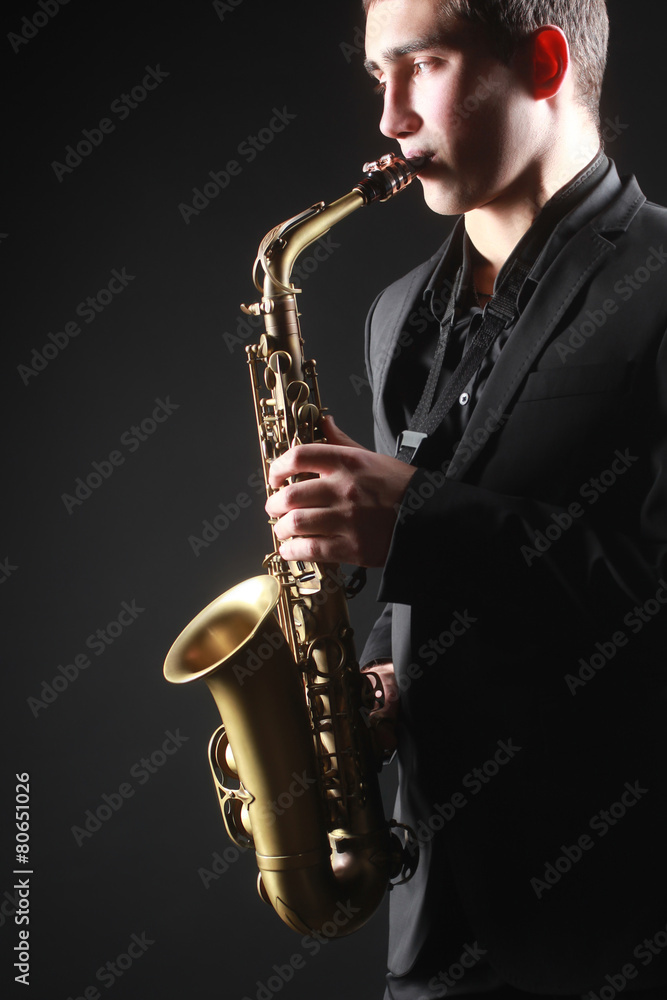 Fototapeta premium Saxophone player Saxophonist with sax alto