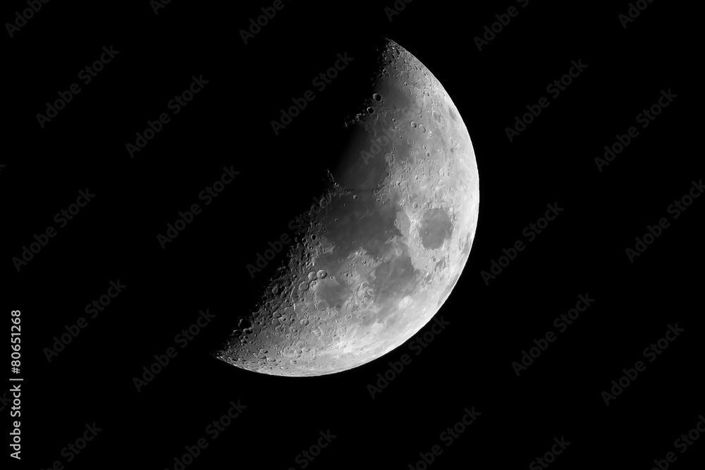 Half earth moon with craters close up Half earth moon with craters close up