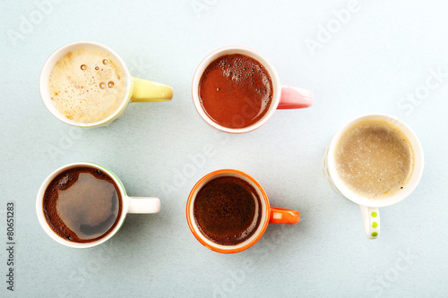 Many cups of coffee on table, top view
