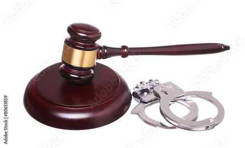 judge gavel and handcuffs isolated on white background.