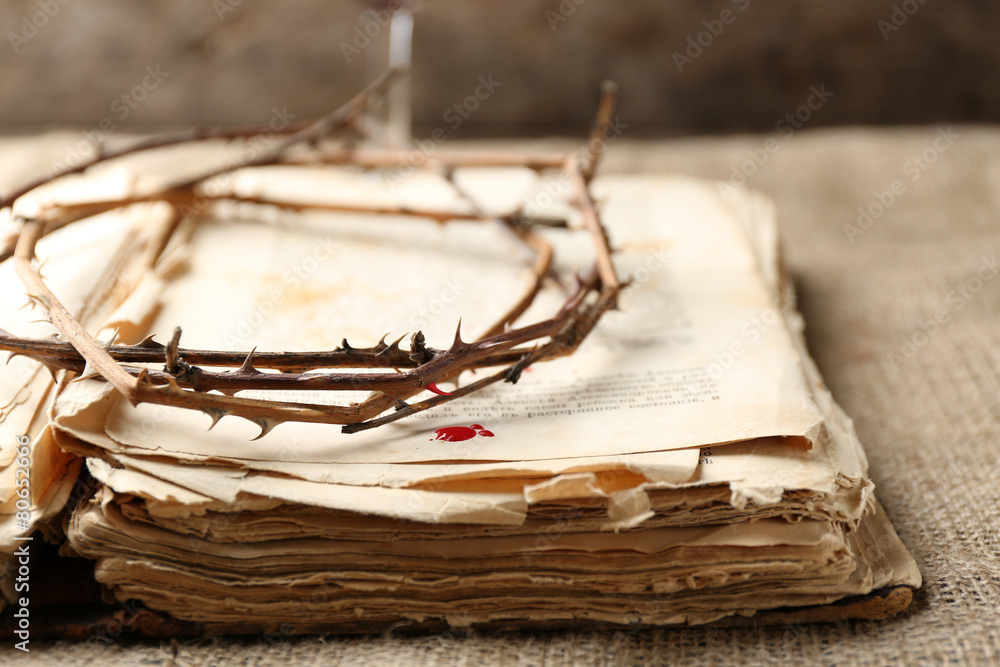 Fototapeta premium Crown of thorns with blood and bible, close up
