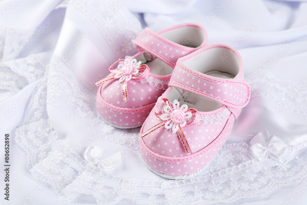 Booties on cloth background Booties on cloth background