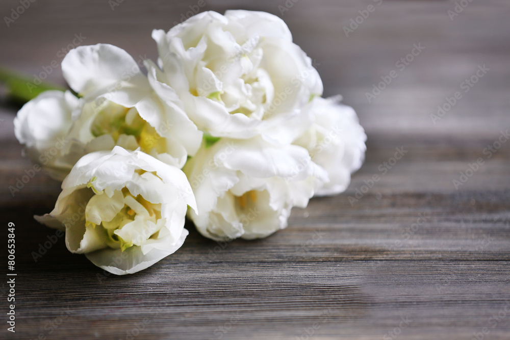 Fresh tulips on wooden table, closeup Fresh tulips on wooden table, closeup