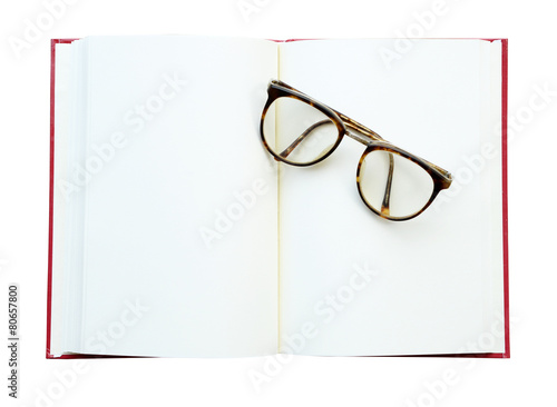glasses on the open book. Isolated on white (clipping path)