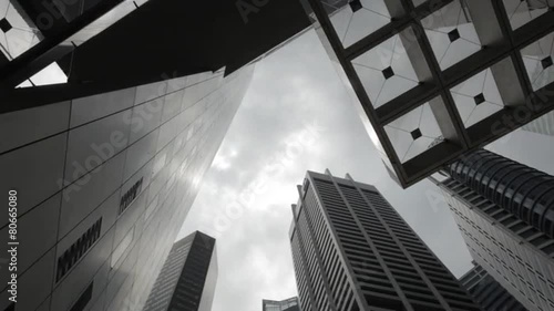 Time Lapse of clouds rolling by at office buildings in financial district