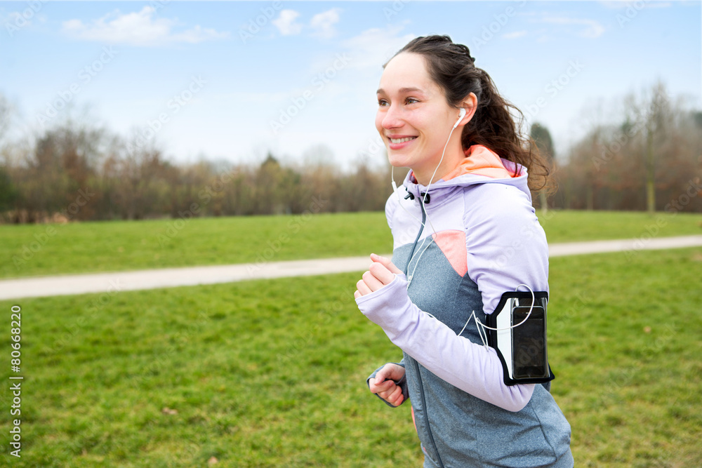 Young attractive woman running at the park Young attractive woman running at the park