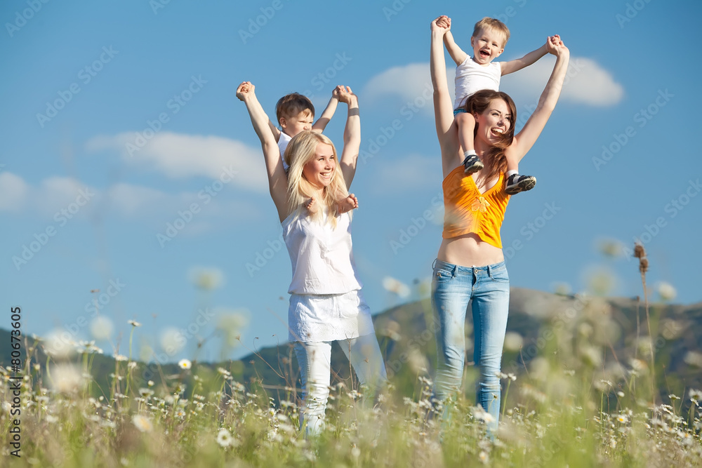 Women with there children are relaxing in nature Women with there children are relaxing in nature