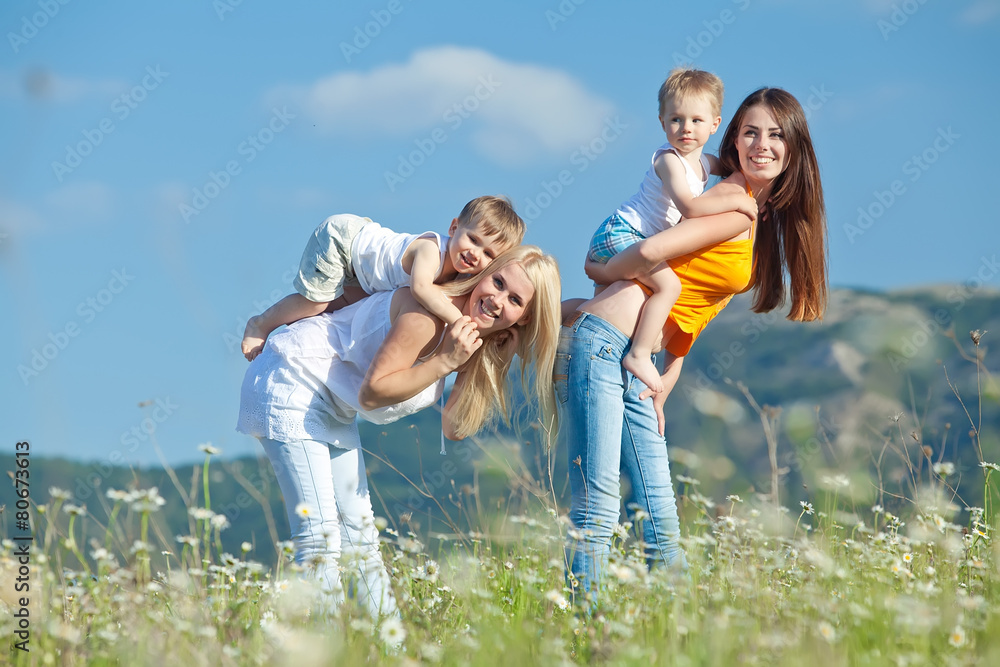 Women with there children are relaxing in nature Women with there children are relaxing in nature