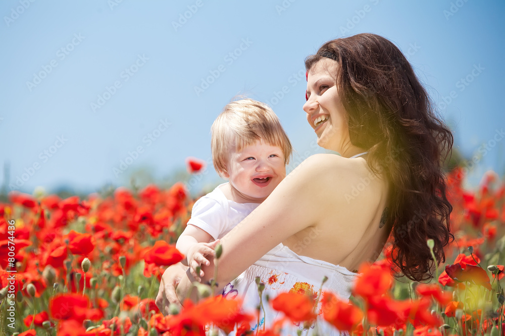 Mother with her son in the flowers field Mother with her son in the flowers field