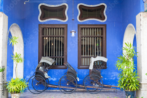 Old rickshaw tricycle near Blue Mansion, Penang photo