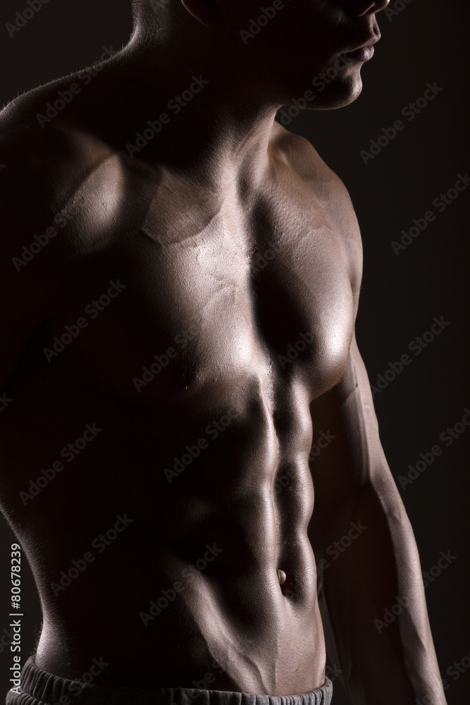 muscular man body with black background