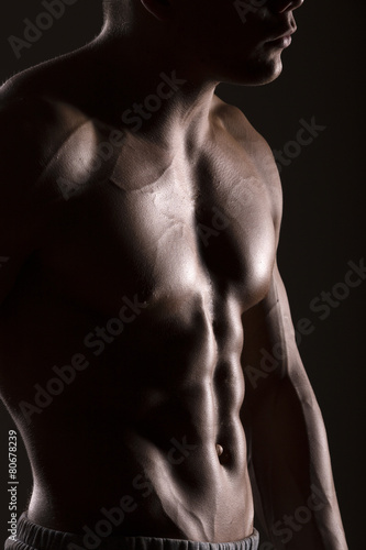 muscular man body with black background