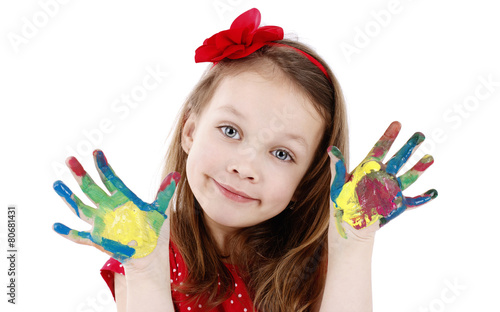 Little artist with dirty hands - isolated studio portrait