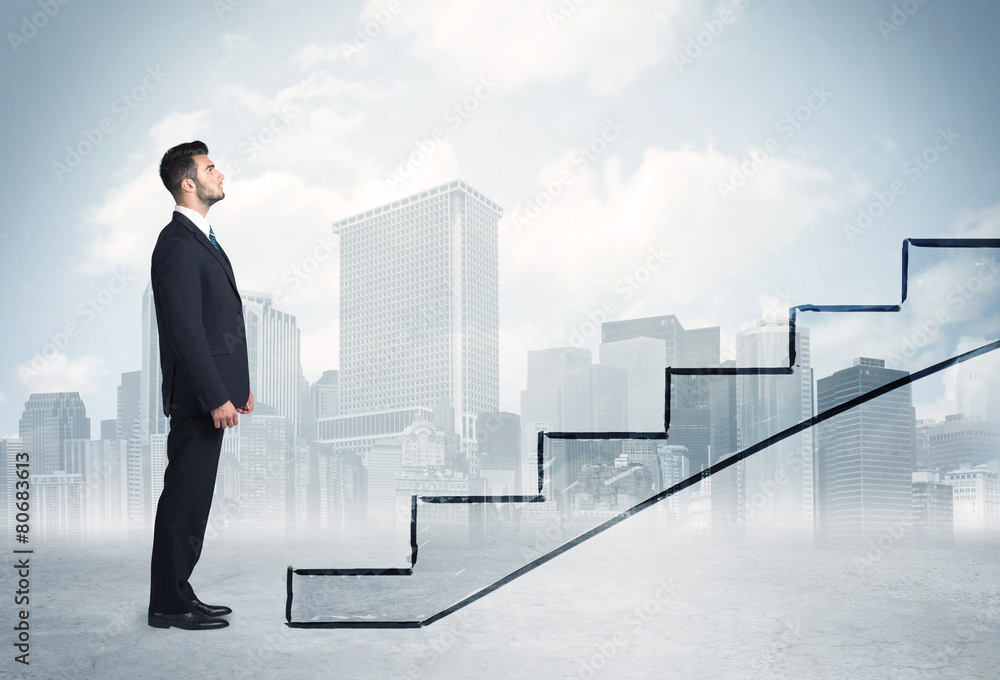 Business person in front of a staircase Business person in front of a staircase