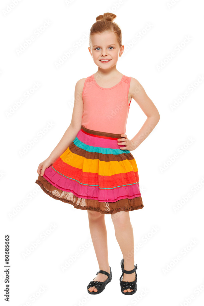 Little happy girl full lenght in colorful skirt, isolated