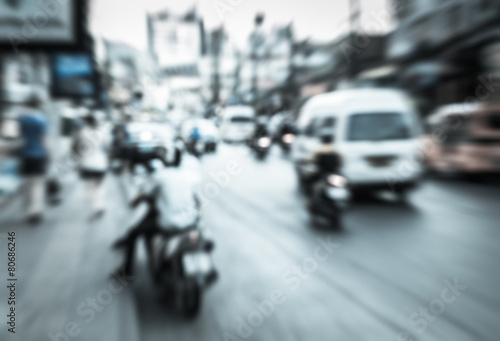 Blurred vehicle and motorcycle moving on the road