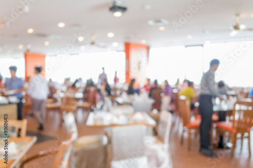 Blurred people in the cafeteria © surasaki