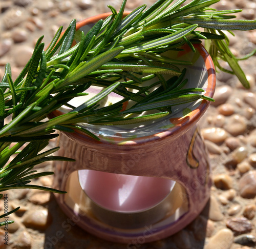 Aromatic lamp with branches of rosemary. photo