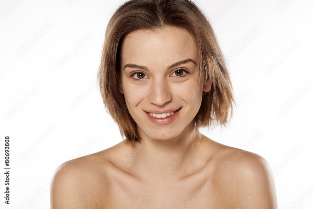 Happy young beautiful girl without make up on white background Happy young beautiful girl without make up on white background