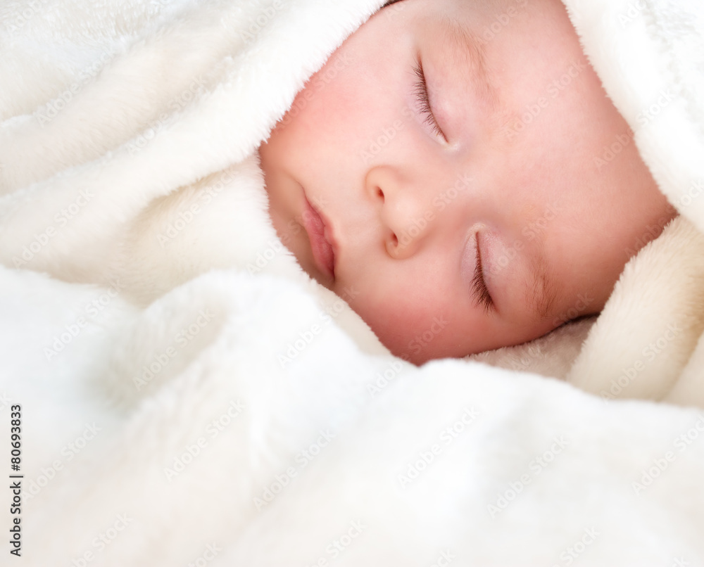Baby sleeping covered with soft blanket Baby sleeping covered with soft blanket