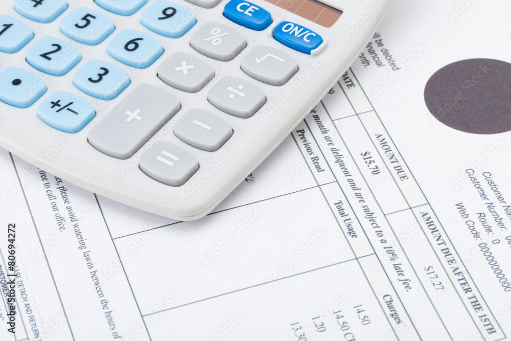 Calculator with monthly utility bill under it Calculator with monthly utility bill under it