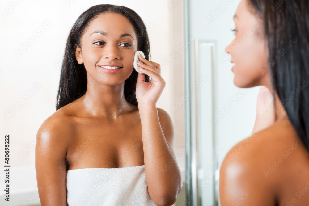 Taking good care of her face. Taking good care of her face.