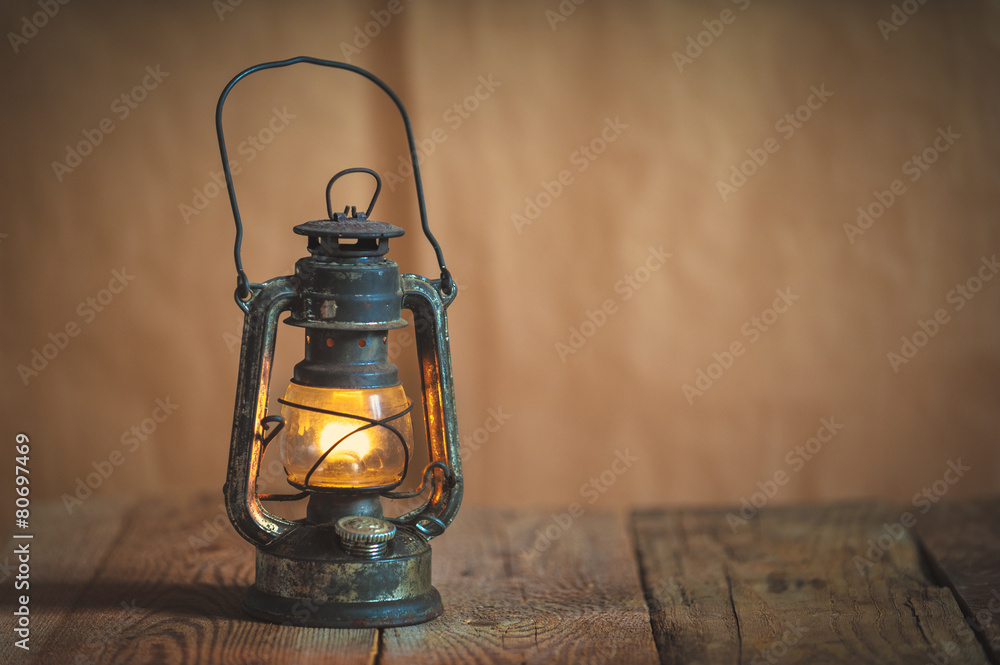 vintage kerosene oil lantern lamp burning with a soft glow light