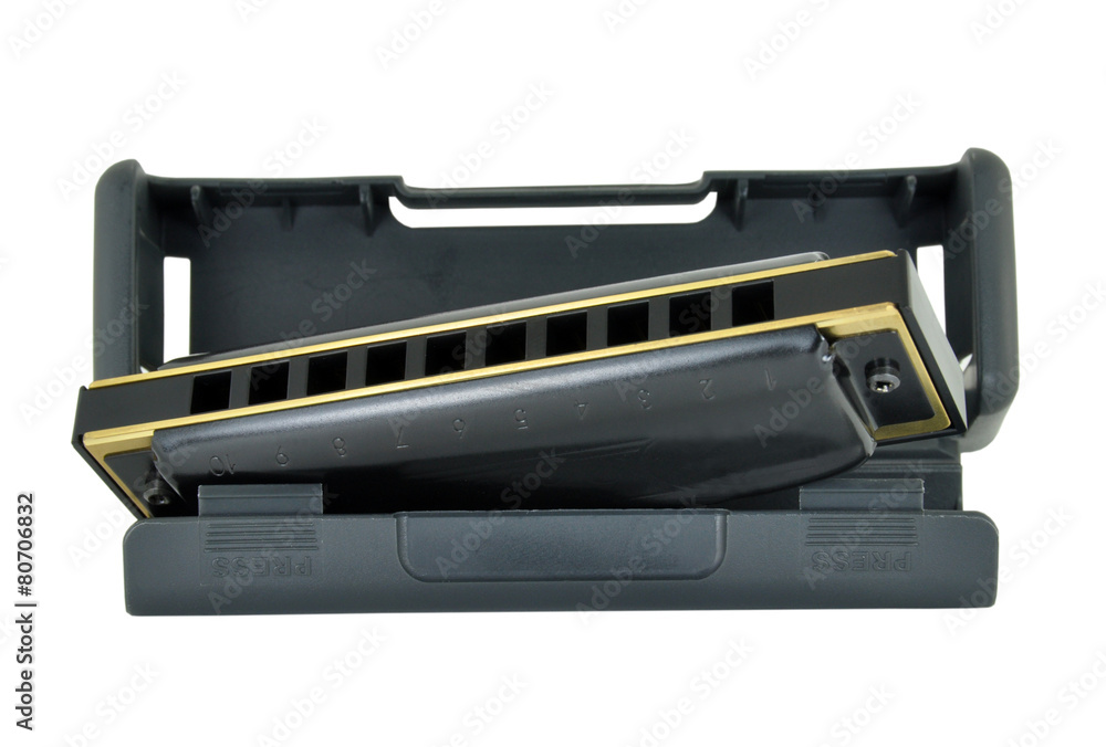 Blues Harp & Case isolated on a white background Blues Harp & Case isolated on a white background