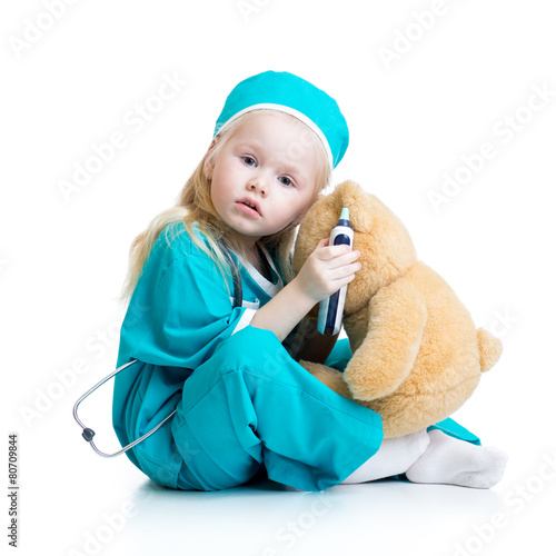 kid girl playing doctor wit...