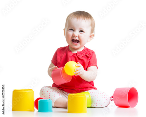 little girl playing with toys