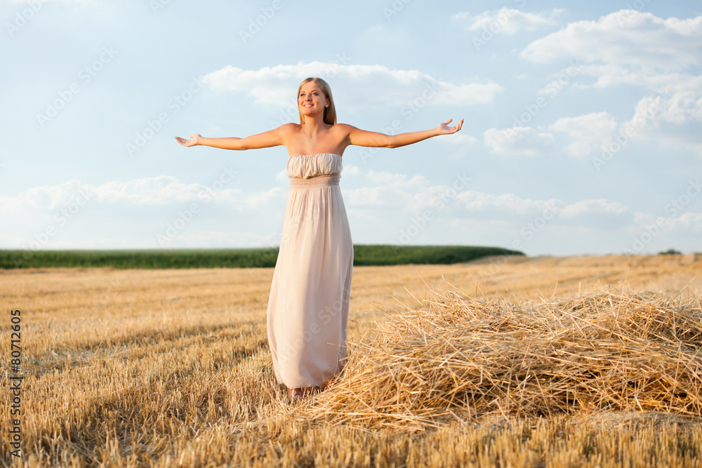 Happy woman in wheat field after harvest Happy woman in wheat field after harvest