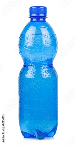 A wet blue bottle of mineral water on a white background