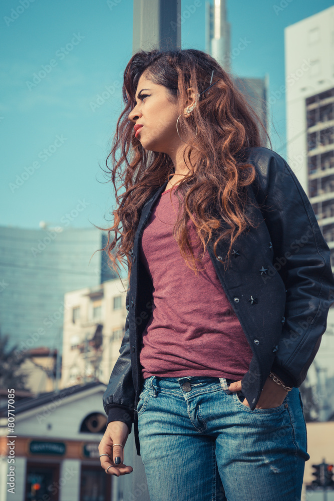 Beautiful girl posing in an urban context Beautiful girl posing in an urban context