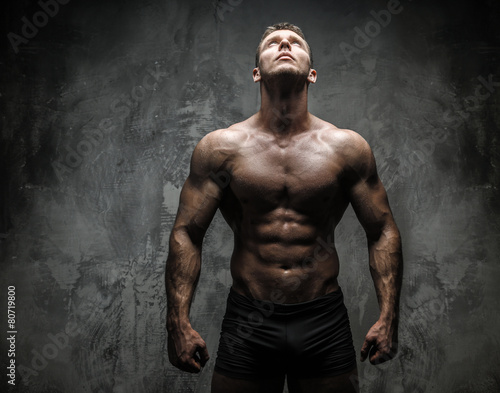 Strong muscular male in studio photo